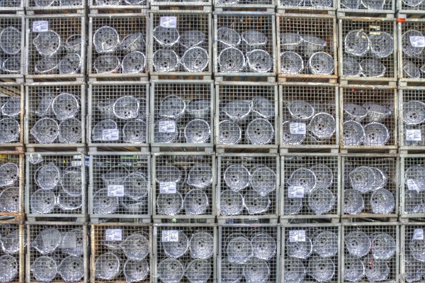 Car parts in the pallet cage in the warehouse