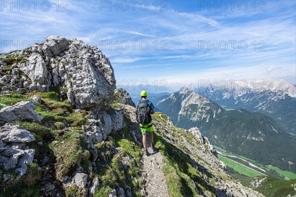 Mountaineers hiking on the Mittenwalder Hoehenweg via ferrata