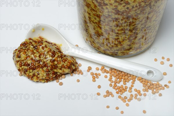 Grainy mustard with porcelain spoon
