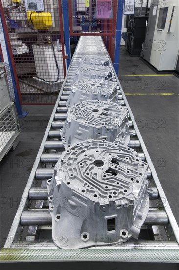 Car parts on a conveyor belt in a car parts factory