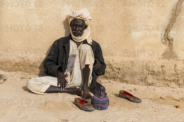 Old man before a mosque in a village at Ounianga kebir part of the the Unesco sight Ounianga lakes