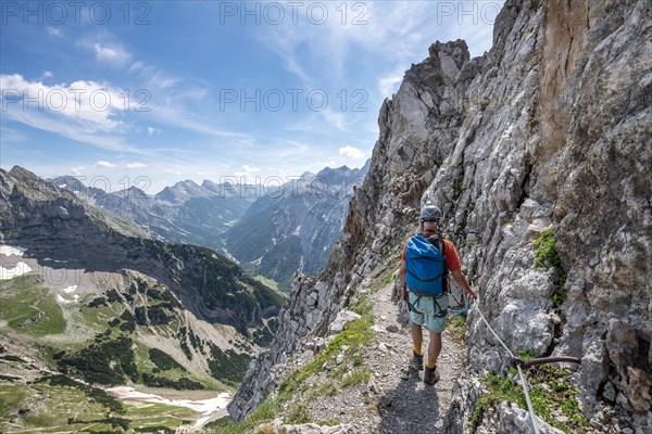 Mountaineer on a secured via ferrata