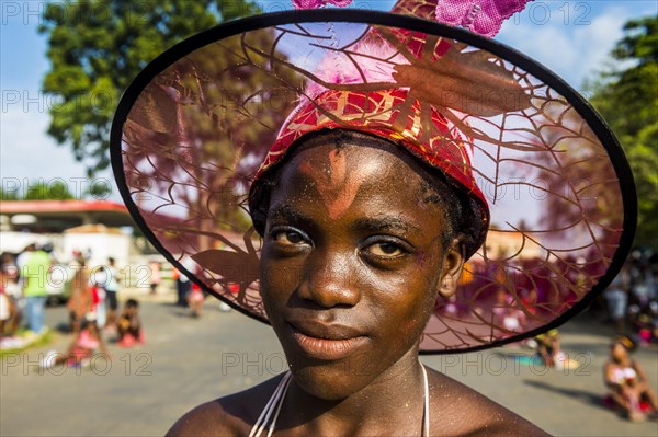 Girl posing at the Carneval in the town of Sao Tome