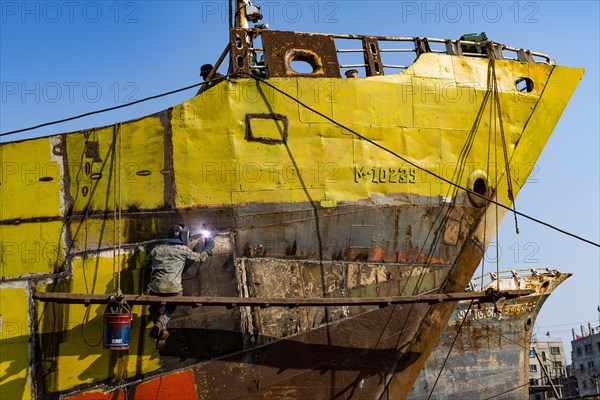 Man welding on a ship