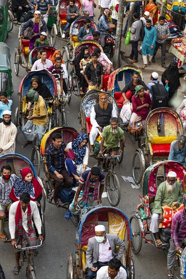 Completely with rickshaws overcrowded street in the center of Dhaka