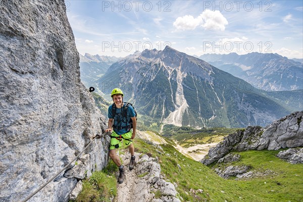 Mountaineer on a secured via ferrata