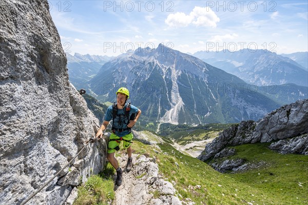 Mountaineer on a secured via ferrata