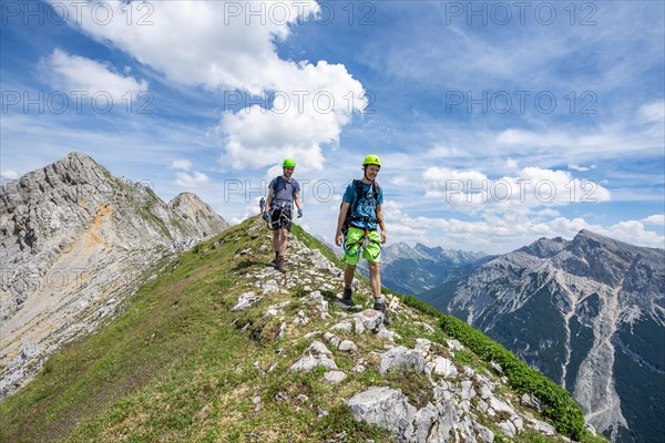 Climber on a ridge at a via ferrata