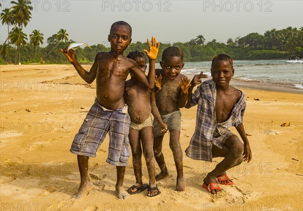 Young boys posing on a beach