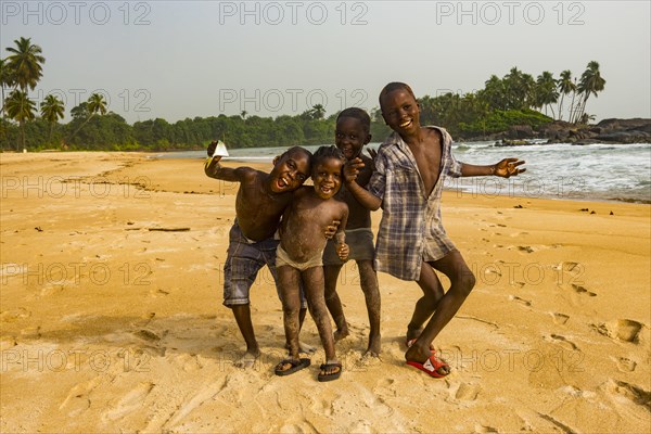 Young boys posing on a beach