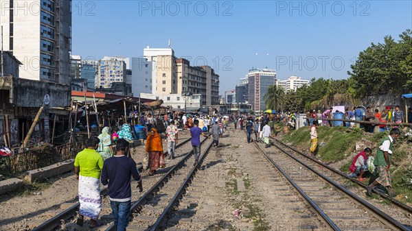 Street vendors on the railway tracks going through Kawran Bazar