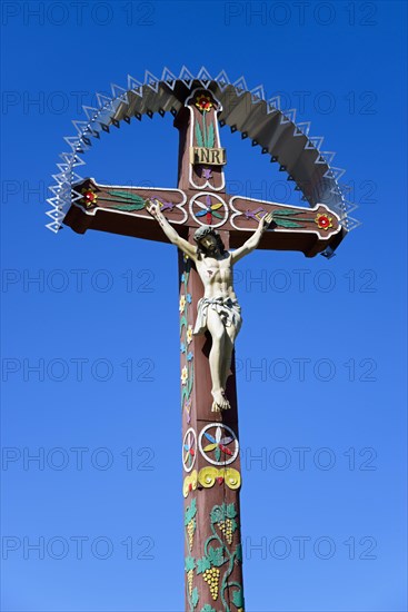 Typical colourful wooden cross at the cemetery