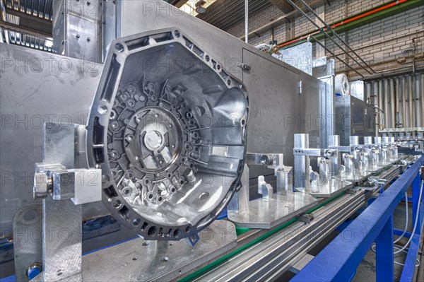 Engine part on the assembly line of the car parts factory