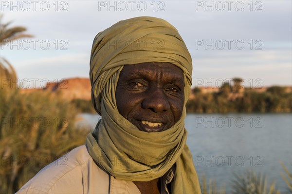 Beduin at the shore of Ounianga kebir part of the the Unesco sight Ounianga lakes