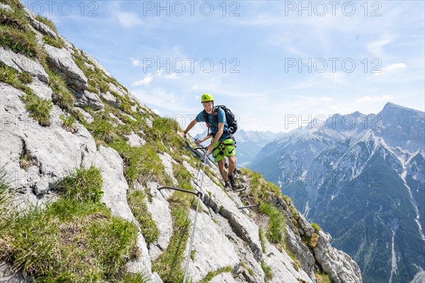 Mountaineer on a secured via ferrata