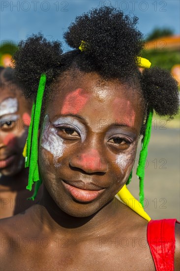 Girl posing at the Carneval in the town of Sao Tome