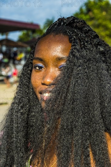 Girl posing at the Carneval in the town of Sao Tome