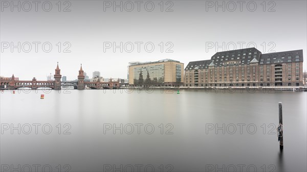 The Oberbaum Bridge connecting the Berlin districts Kreuzberg and Friedrichshain with the Universal Building