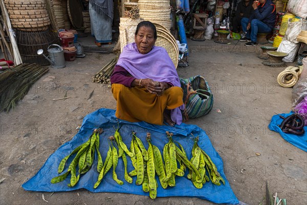 Woman vendor selling vegetables
