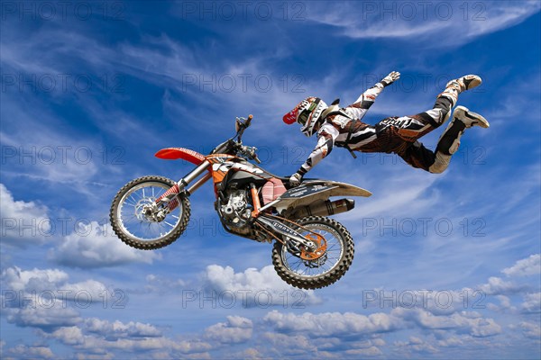 Motocross motorcycle and rider in the air