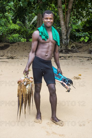 Man presenting his fresh caught squid