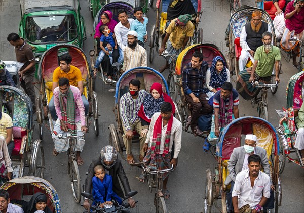 Completely with rickshaws overcrowded street in the center of Dhaka