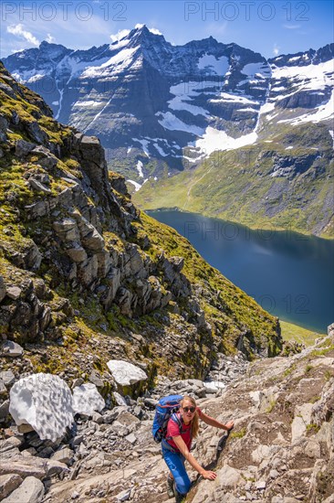 Hiking on a steep trail to Innerdalstarnet