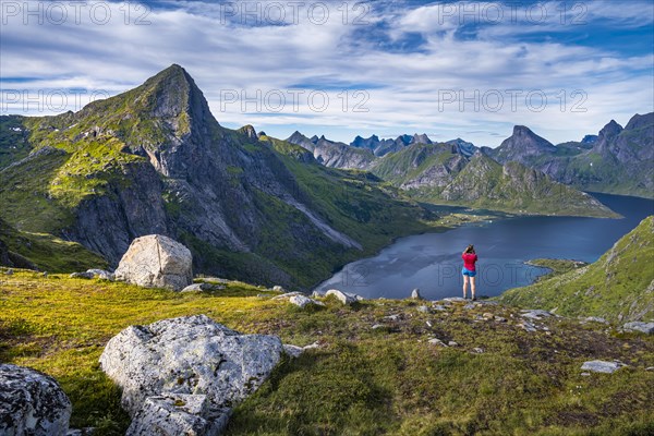 Hiker looking at fjord Forsfjorden