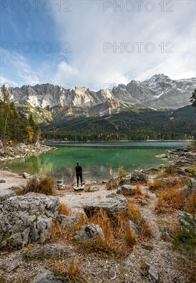 Young woman standing on the shore