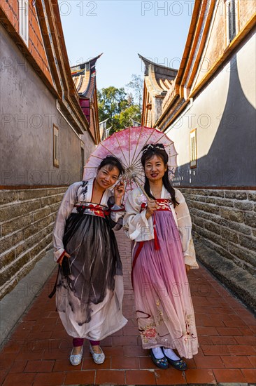 Local dressed women in the traditional Minnan-style houses