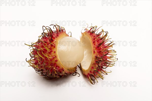 Rambutan whole and peeled on white background