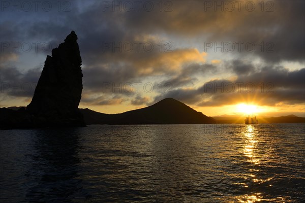 Pinnacle Rock at sunset with clouds