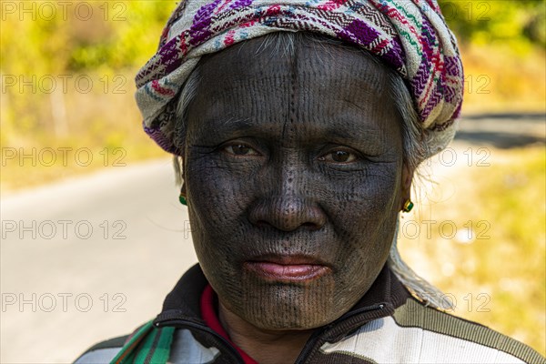 Yin-Du Chin woman with a complete black tattoed face