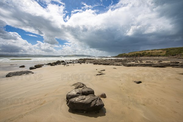 Sandy beach beach and rocks in Curio Bay