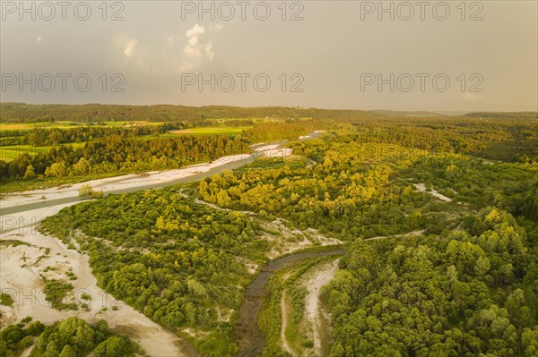 Isar in evening light with rain clouds