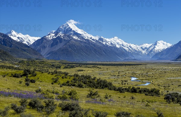 View of Mount Cook and snow covered mountains with Tasman River
