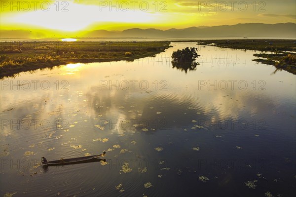 Rowing boat at sunset