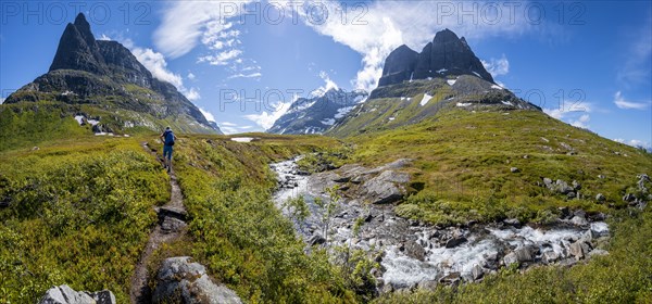 Hiker on a hiking trail to Innerdalstarnet