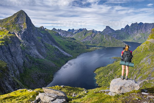 Hiker looking at fjord Forsfjorden