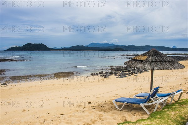 Sun lungers on a sandy beach of a four star hotel in Ilheu das Rolas