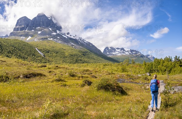 Hiker on a hiking trail to Innerdalstarnet