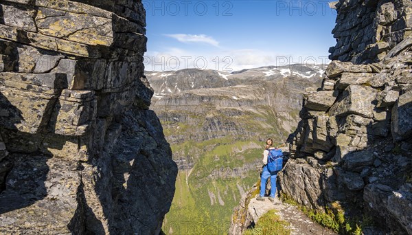 Hiker on a hiking trail to Innerdalstarnet