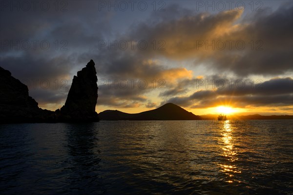 Pinnacle Rock at sunset with clouds