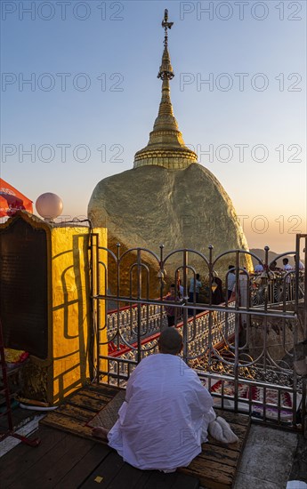 Monk praying at the Kyaiktiyo Pagoda