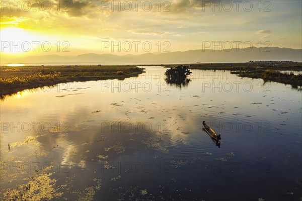 Rowing boat at sunset