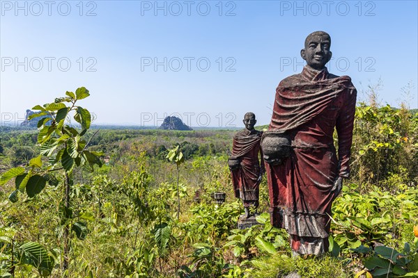 Huge line of monk statues in Win Sein Taw Ya outside Mawlamyine