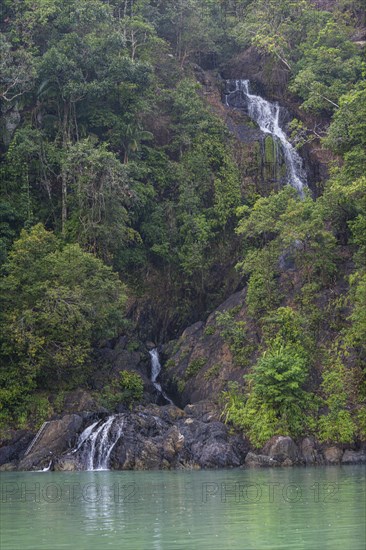 Waterfall dropping right in the ocean on Dome island