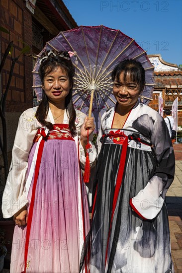 Local dressed women in the traditional Minnan-style houses