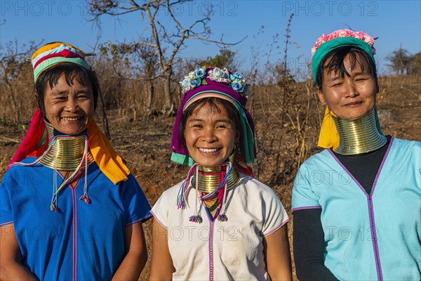 Laughing three Padaung women