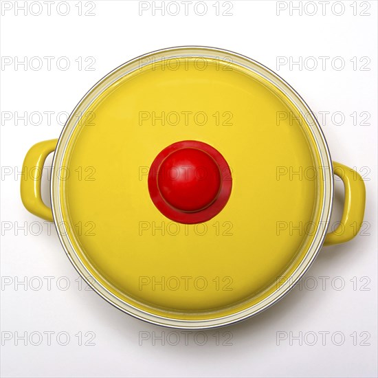 Yellow saucepan with lid on white background